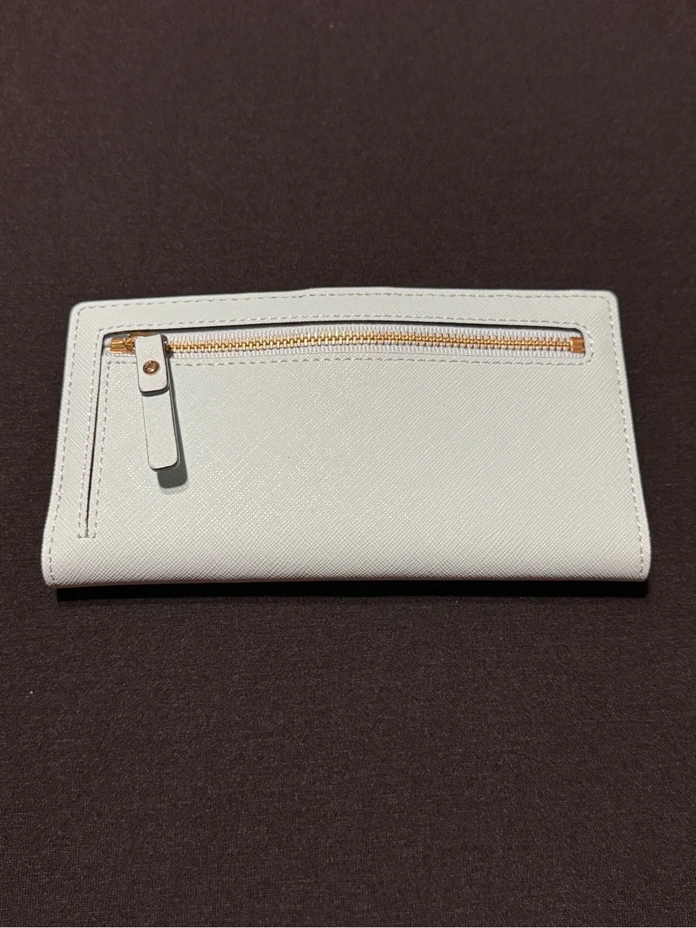 NWOT Kate Spade light blue wallet with gold logo